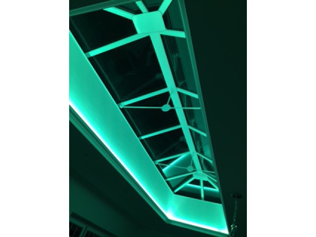 Turquoise lighting around Roof Lantern